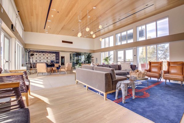 Clubhouse featuring elegant seating and fireplace at Admirals Cove Apartments