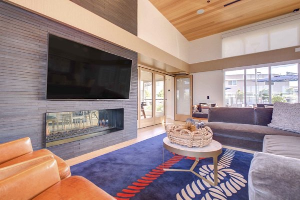 Clubhouse with modern design and ample seating at Admirals Cove Apartments, luxury living by Greystar