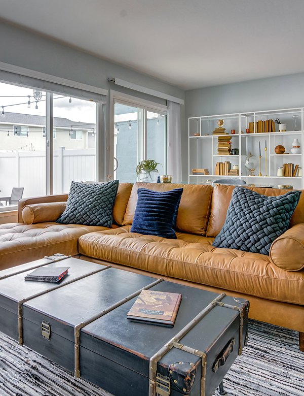 Spacious living room with modern decor at Admirals Cove Apartments
