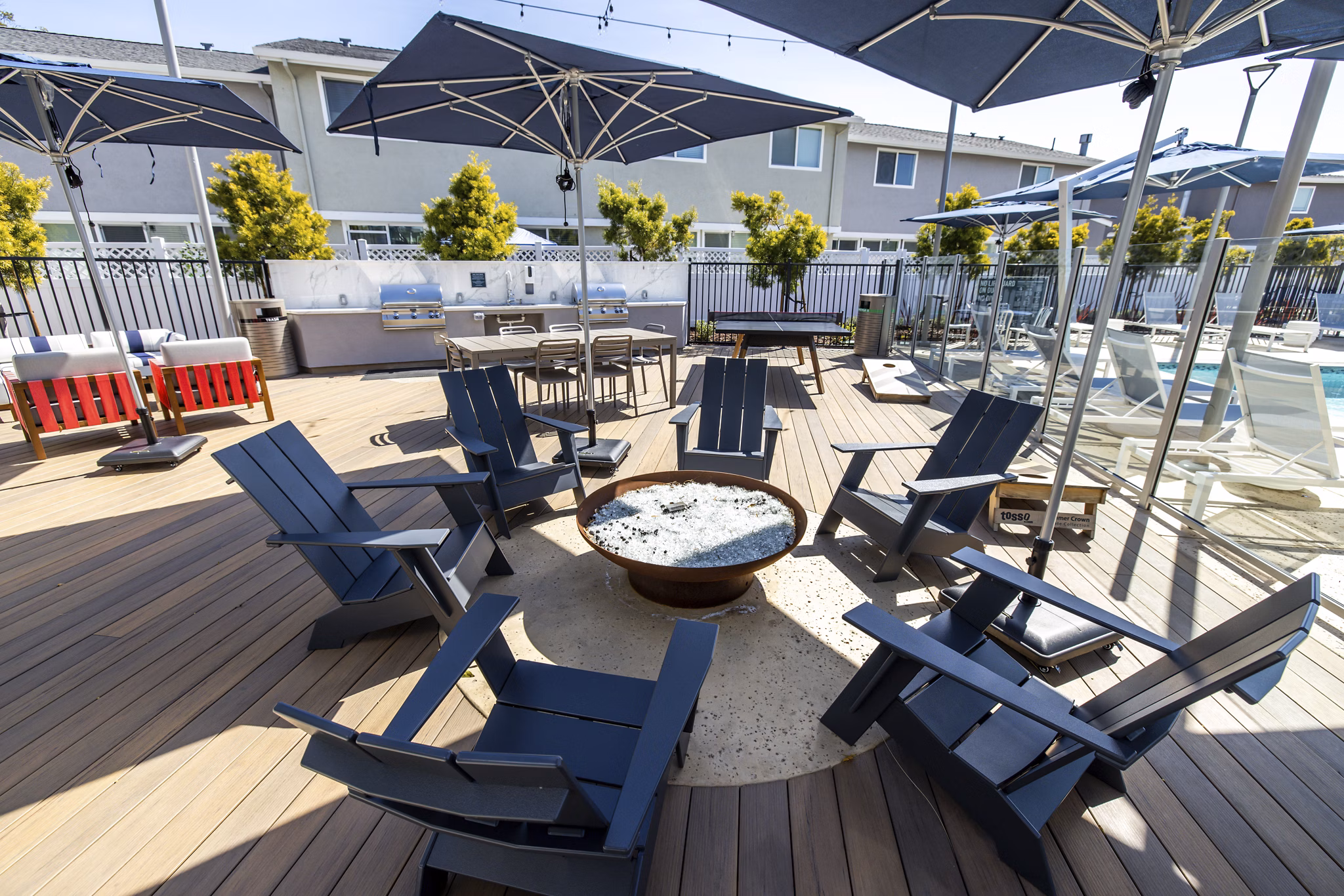 Cozy fire pit surrounded by seating at Admirals Cove Apartments, offering a relaxing outdoor experience