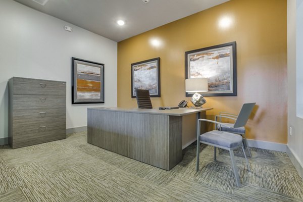 Modern clubhouse with cozy seating and pool table at The Grayson Apartments