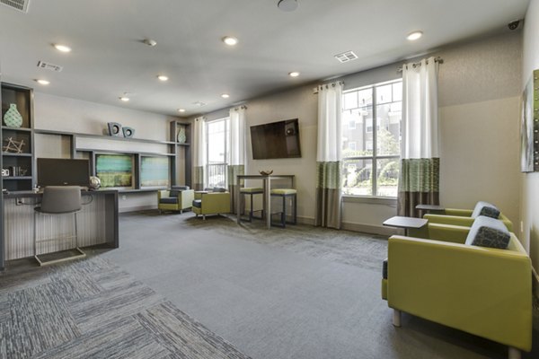 Elegant clubhouse with modern decor at The Grayson Apartments, featuring luxurious seating and community space
