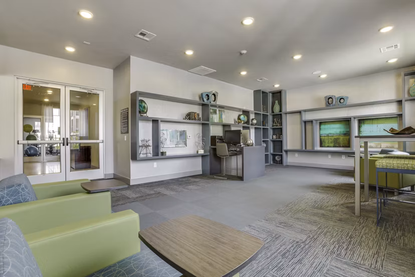 Elegant clubhouse with modern furnishings at The Grayson Apartments, offering luxury living spaces and amenities in a prime location