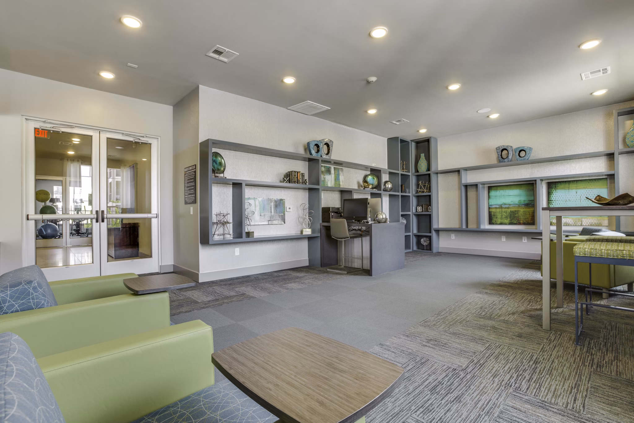 Elegant clubhouse with modern furnishings at The Grayson Apartments, offering luxury living spaces and amenities in a prime location