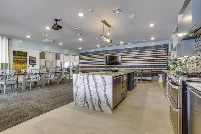 Elegant clubhouse with modern decor at The Grayson Apartments, offering luxurious social spaces for residents in a prime location