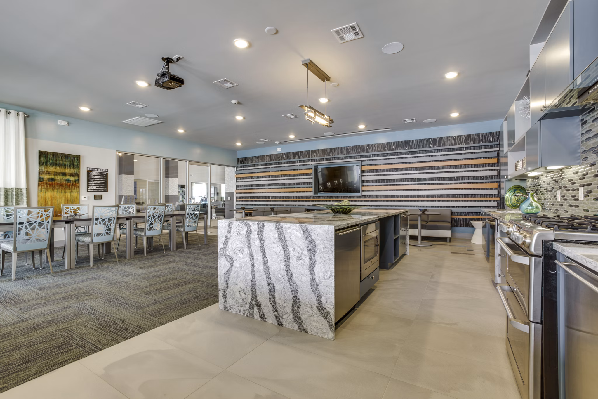 Elegant clubhouse with modern decor at The Grayson Apartments, offering luxurious social spaces for residents in a prime location