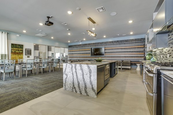 Elegant clubhouse with modern decor at The Grayson Apartments, offering luxurious social spaces for residents in a prime location