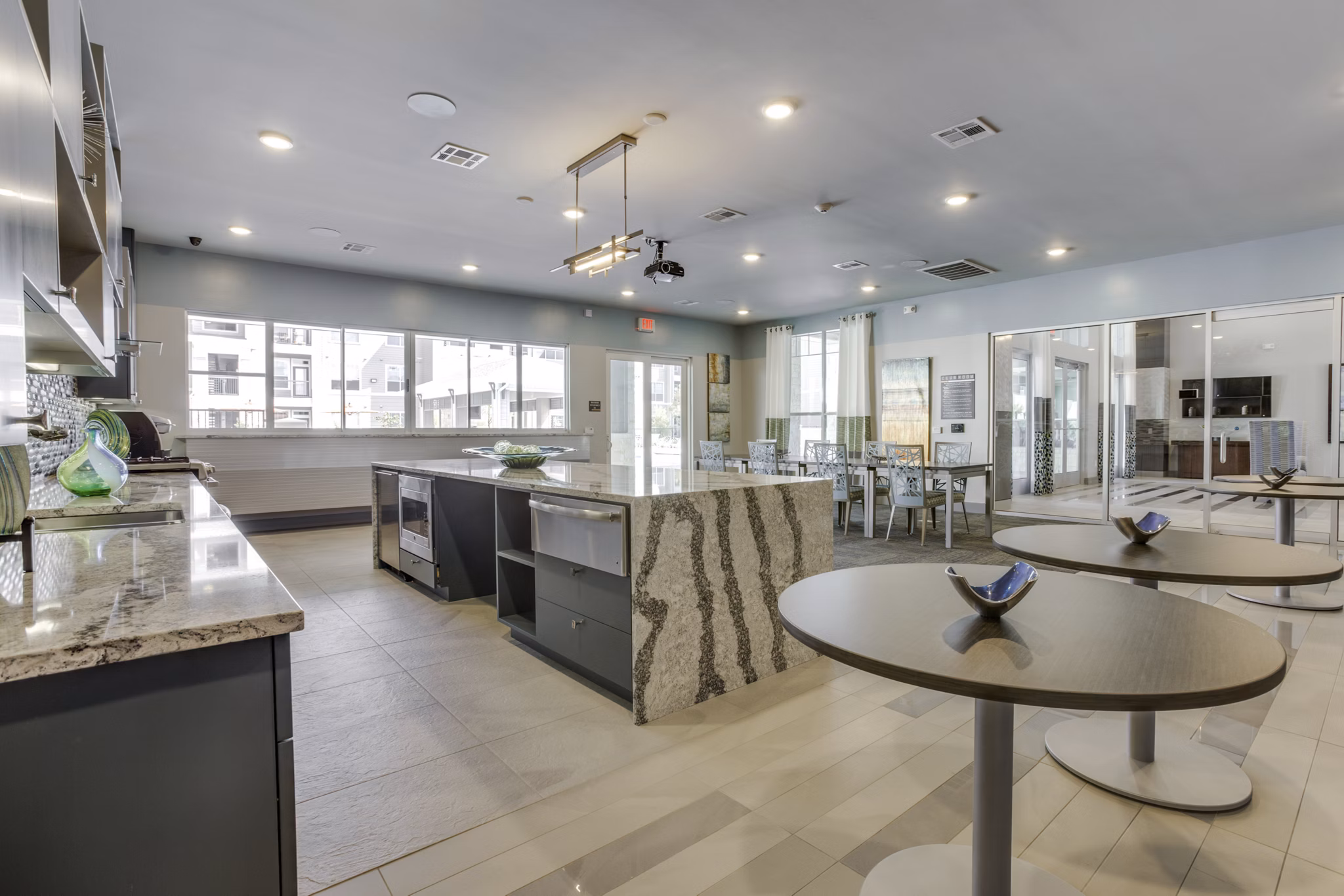 Elegant clubhouse with modern decor at The Grayson Apartments, ideal for social gatherings and luxury living experiences