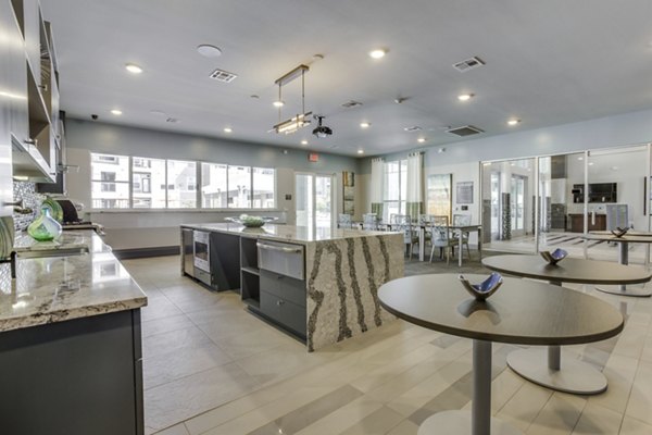Elegant clubhouse with modern decor at The Grayson Apartments, ideal for social gatherings and luxury living experiences
