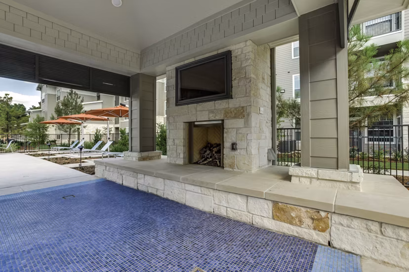 Fire pit outdoor seating at The Grayson Apartments, ideal for relaxing evenings