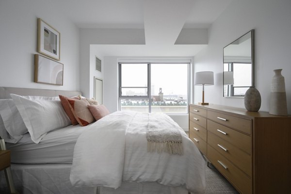 Bedroom featuring modern furnishings and soft lighting in Watermark Central Apartments