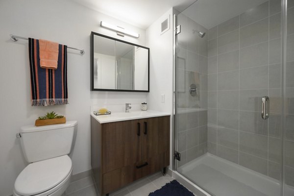 Bathroom featuring modern fixtures and elegant design at Watermark Central Apartments