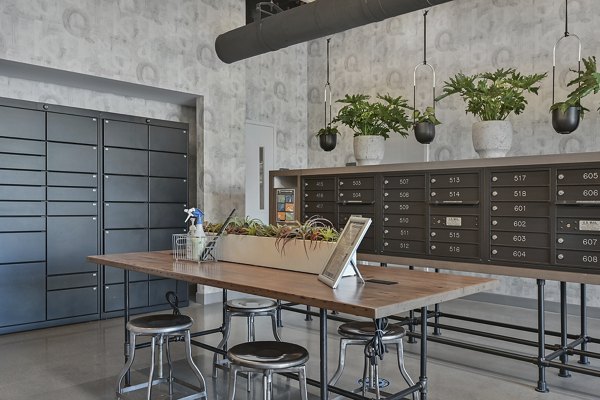 Mailroom facilities at Watermark Central Apartments featuring secure package lockers and spacious layout