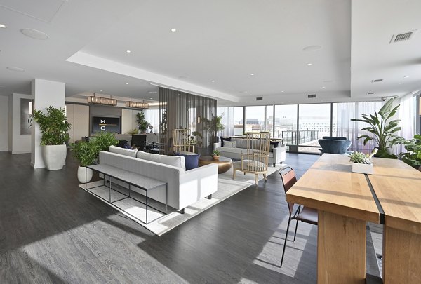 Clubhouse with modern decor and seating at Watermark Central Apartments