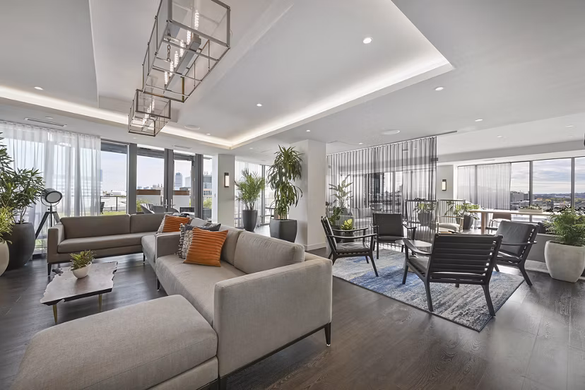 Clubhouse featuring modern design and spacious lounge at Watermark Central Apartments