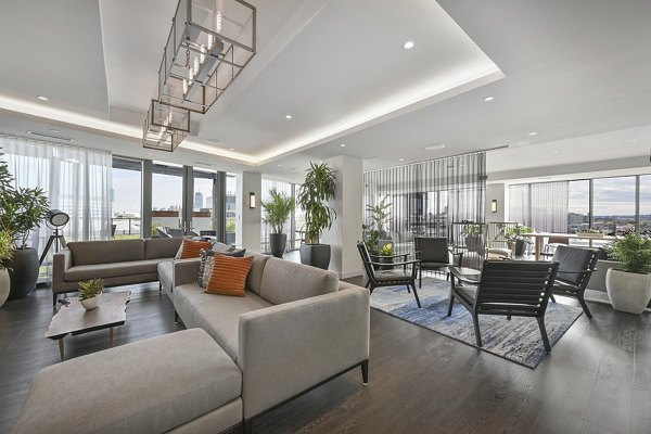 Clubhouse featuring modern design and spacious lounge at Watermark Central Apartments