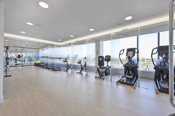 Fully-equipped fitness center with modern machines at Watermark Central Apartments for a healthy lifestyle