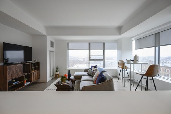 Spacious living room with modern decor in Watermark Central Apartments