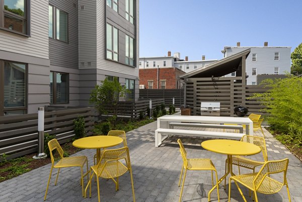 Modern grill area patio at Watermark Central Apartments featuring sleek design perfect for outdoor dining and socializing