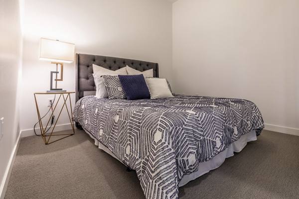 bedroom at Pike Motorworks Apartments