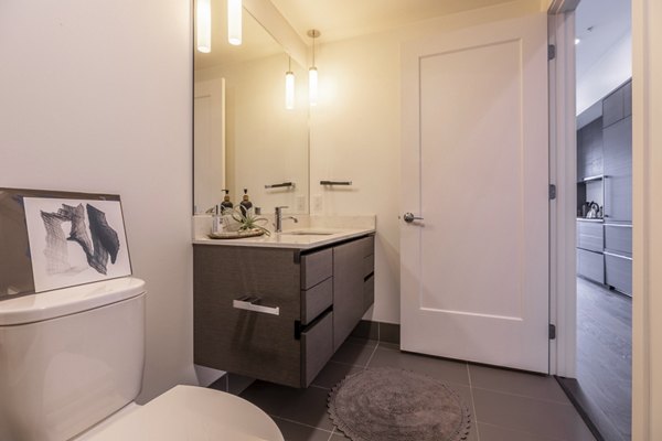 Luxurious bathroom with marble finishes at Pike Motorworks Apartments