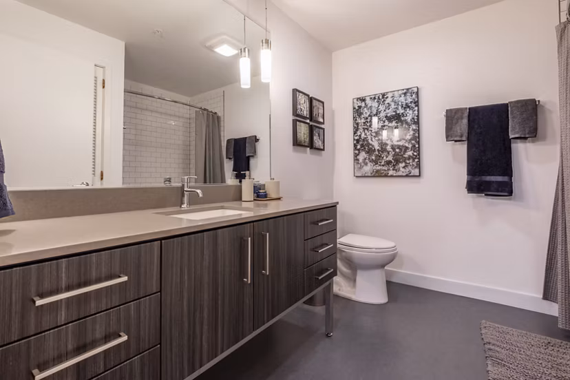 Modern bathroom with sleek fixtures at Pike Motorworks Apartments