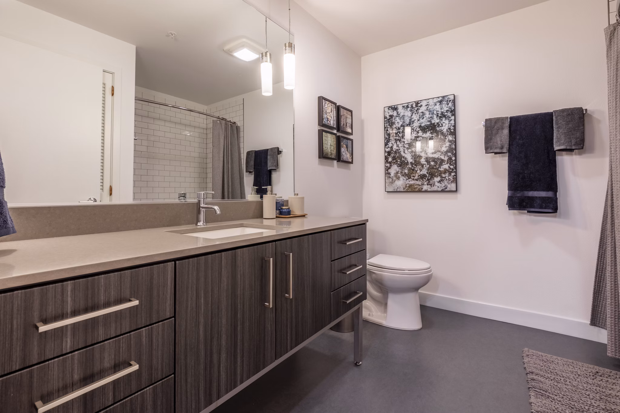 Modern bathroom with sleek fixtures at Pike Motorworks Apartments