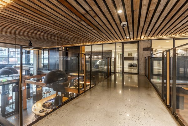 Clubhouse featuring luxury seating and modern design at Pike Motorworks Apartments, a premium property in Seattle