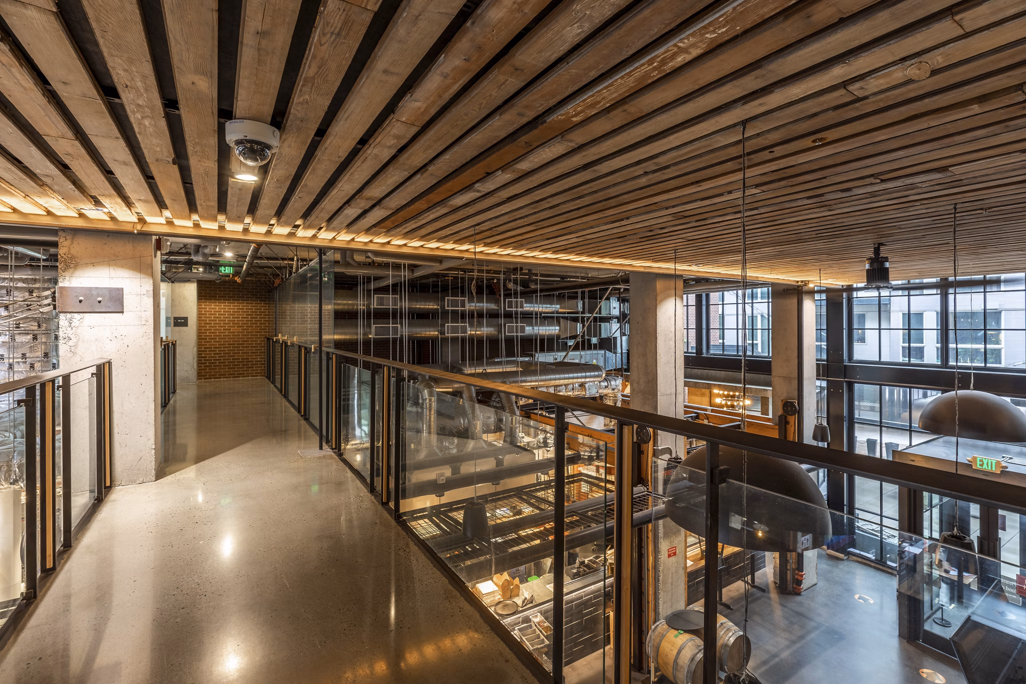Clubhouse featuring modern design and entertainment spaces at Pike Motorworks Apartments