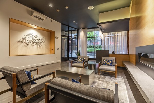 Modern clubhouse featuring stylish furnishings at Pike Motorworks Apartments