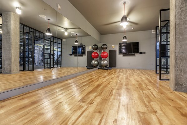fitness center at Pike Motorworks Apartments