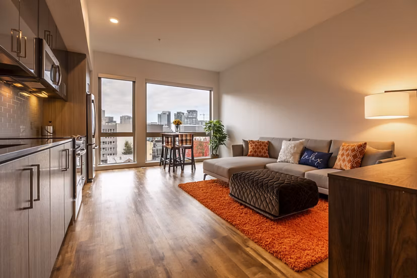 Modern living room with sleek furnishings at Pike Motorworks Apartments, ideal for luxury living in Seattle's Capitol Hill neighborhood