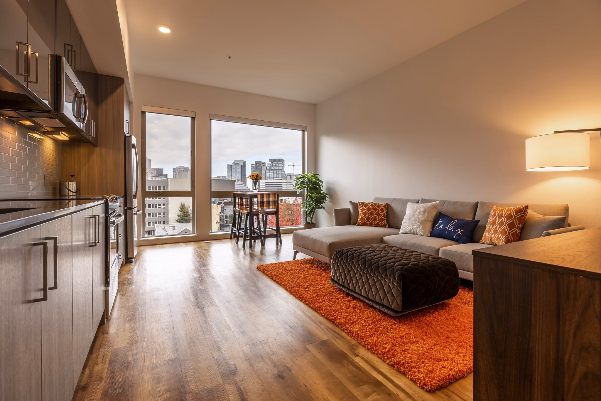 Modern living room with sleek furnishings at Pike Motorworks Apartments, ideal for luxury living in Seattle's Capitol Hill neighborhood
