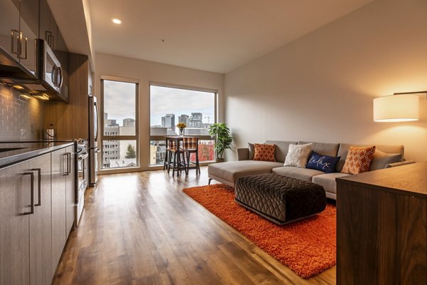 Modern living room with sleek furnishings at Pike Motorworks Apartments, ideal for luxury living in Seattle's Capitol Hill neighborhood