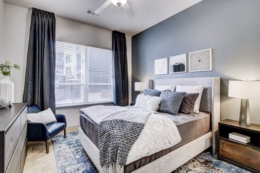 Bedroom featuring modern decor and large windows in Mason at Alameda Station Apartments
