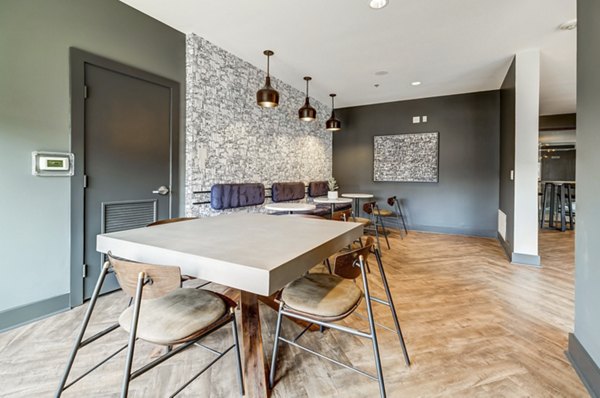 Mason at Alameda Station Apartments: Elegant clubhouse with modern amenities and stylish seating areas