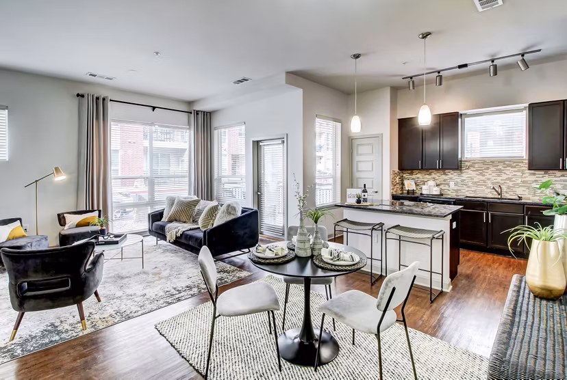 Dining area with modern seating and pendant lighting at Mason at Alameda Station Apartments