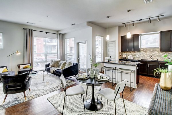 Dining area with modern seating and pendant lighting at Mason at Alameda Station Apartments