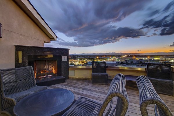 Spacious rooftop deck with seating and city views at Mason at Alameda Station Apartments