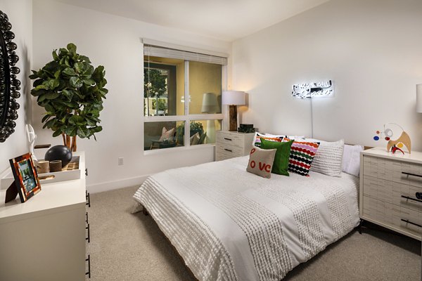 Cozy bedroom with modern decor in Clarendon Apartments, luxury living space