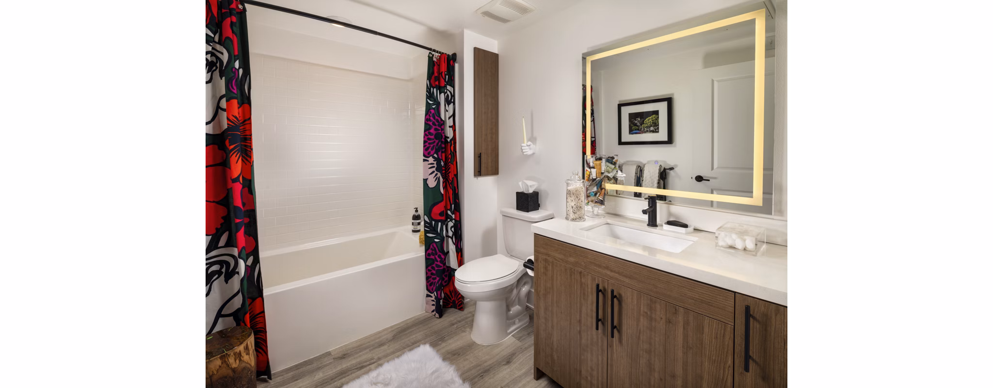 Bathroom featuring modern fixtures and elegant tile design at Clarendon Apartments
