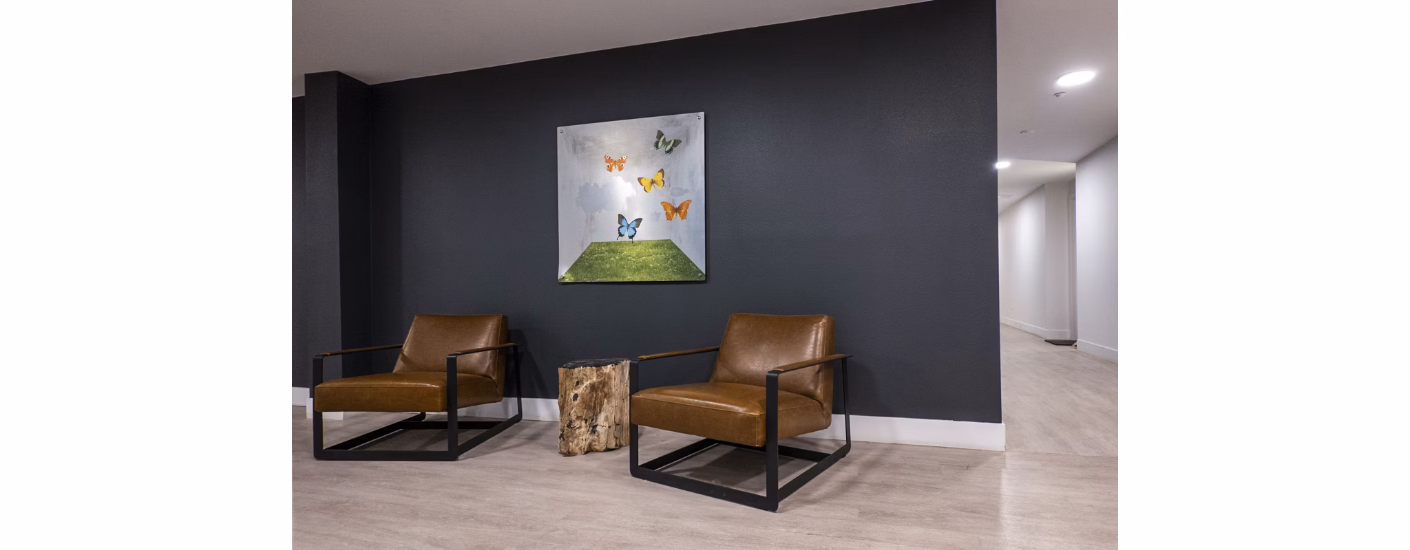 Clarendon Apartments: Elegant clubhouse lobby with modern decor and seating areas for luxury living
