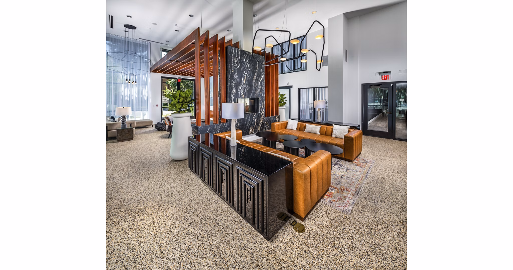 Clarendon Apartments: Elegant clubhouse lobby featuring modern decor and seating areas