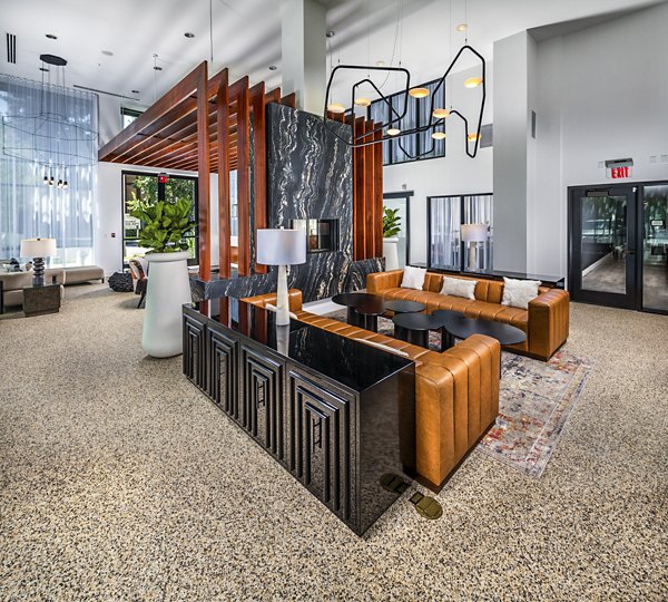 Clarendon Apartments: Elegant clubhouse lobby featuring modern decor and seating areas
