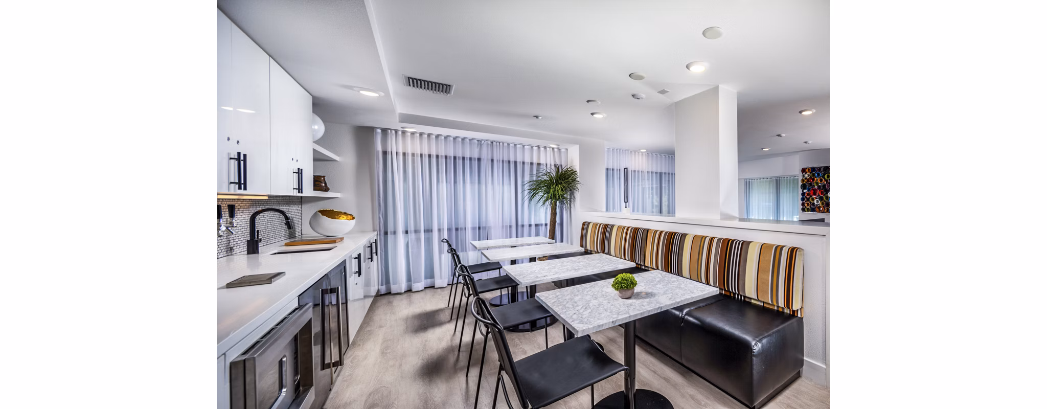 Clarendon Apartments: Modern clubhouse/lobby with stylish decor and seating in luxury Greystar property