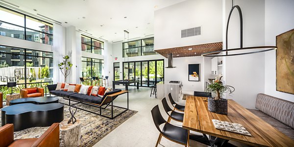 Clarendon Apartments: Modern clubhouse lobby with elegant seating and lighting elements