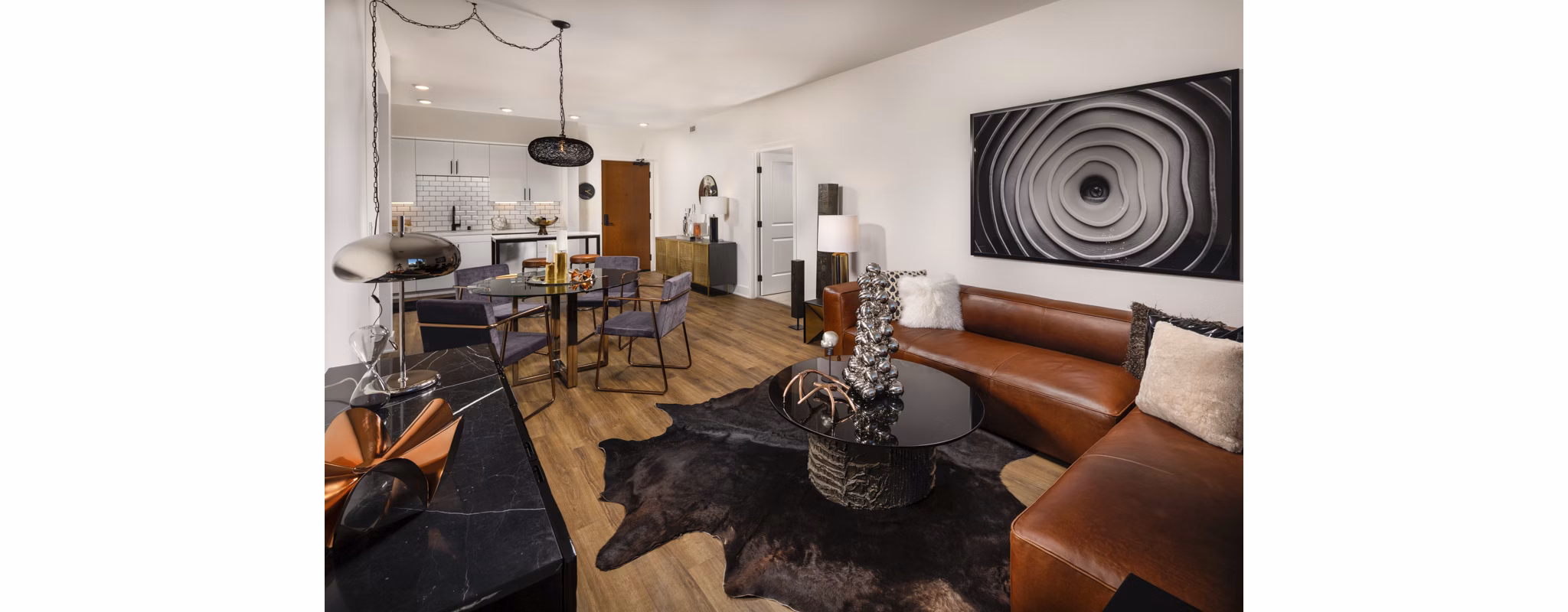Spacious living room with modern decor and natural light in Clarendon Apartments