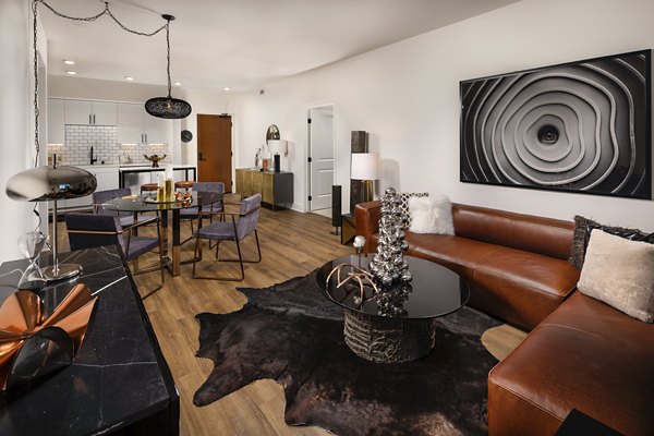 Spacious living room with modern decor and natural light in Clarendon Apartments