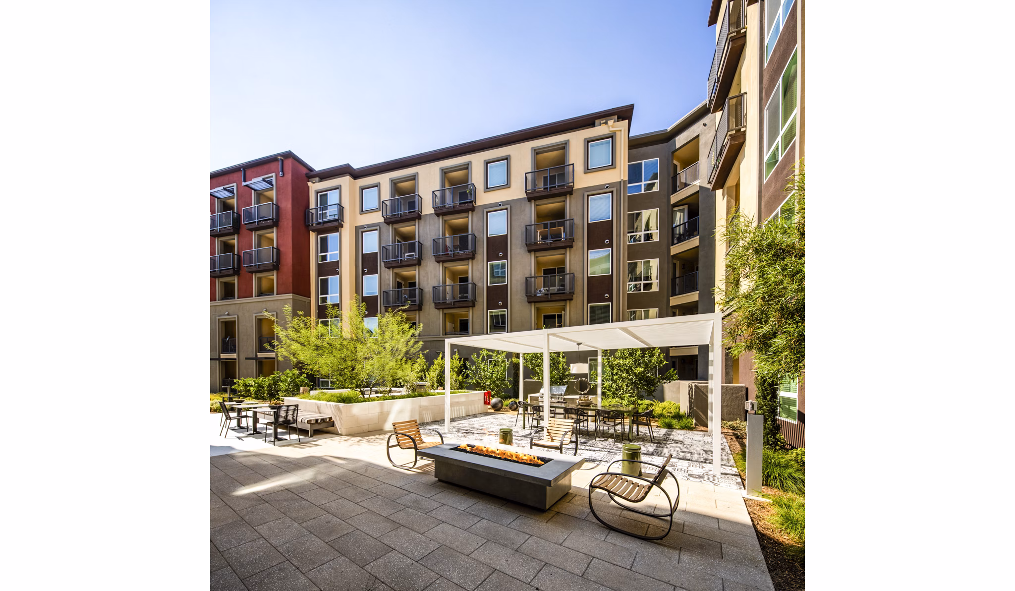 Clarendon Apartments: Cozy outdoor fire pit area for residents to relax and unwind