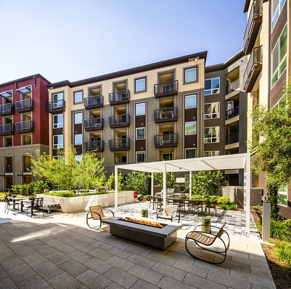 Clarendon Apartments: Cozy outdoor fire pit area for residents to relax and unwind